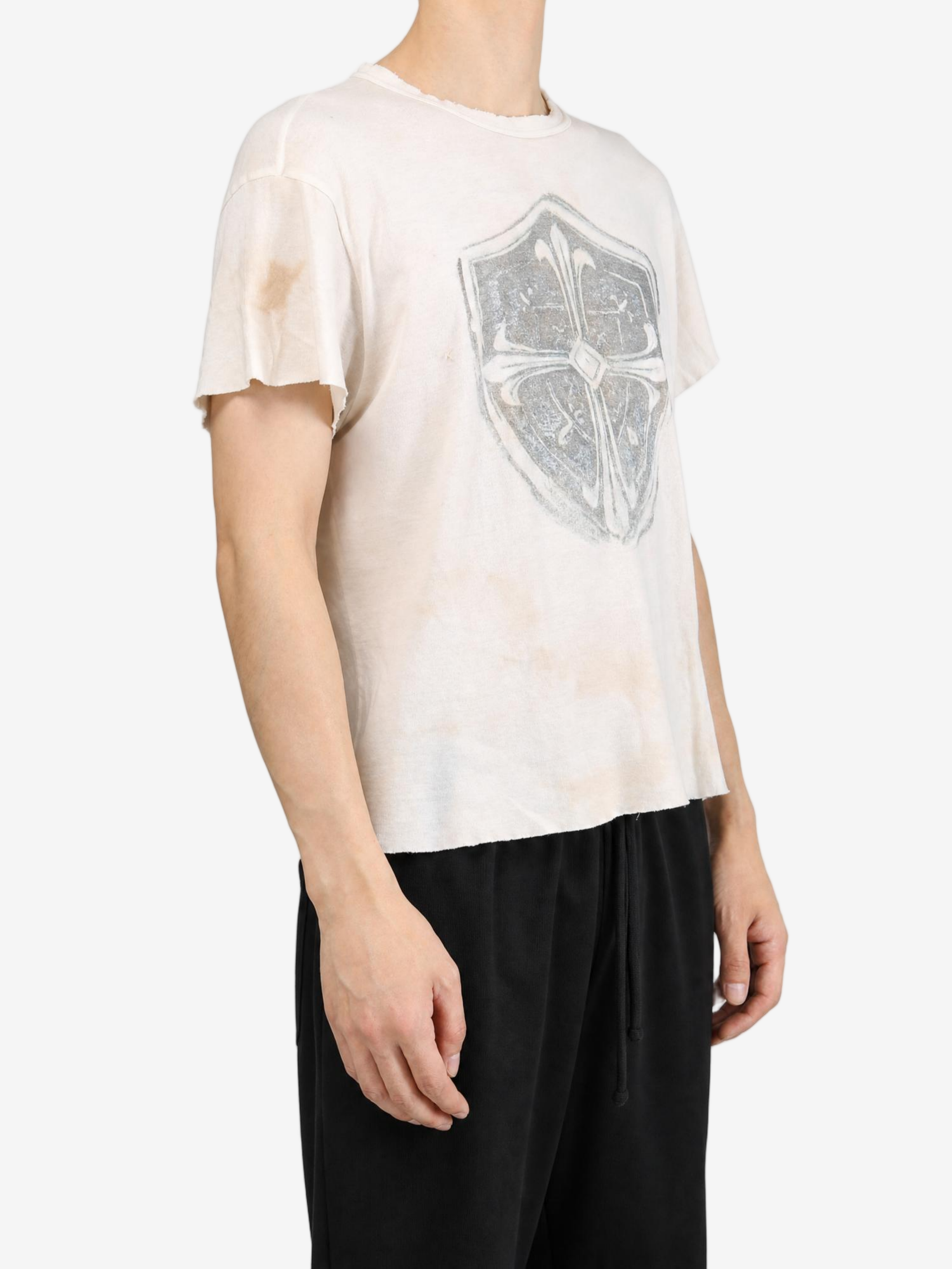 Tan t-shirt worn by a person, showing the t-shirt fit