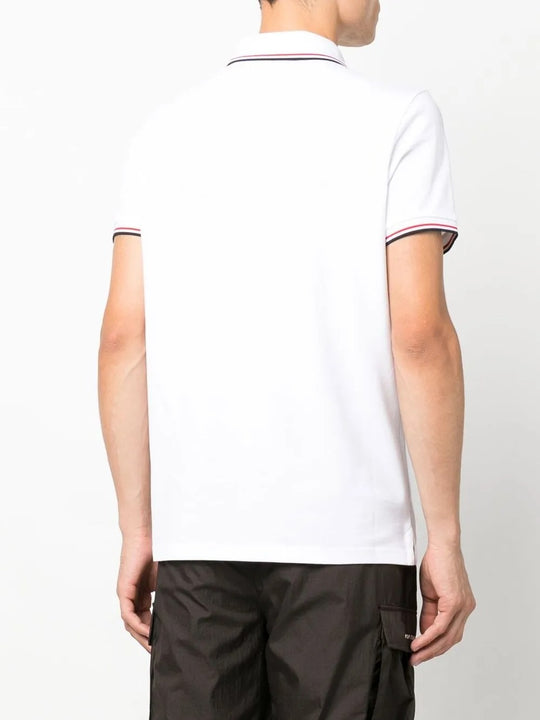 White shirt worn by a person, showing the shirt's fit