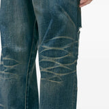 Close up of blue pants, showing texture of the cotton fabric