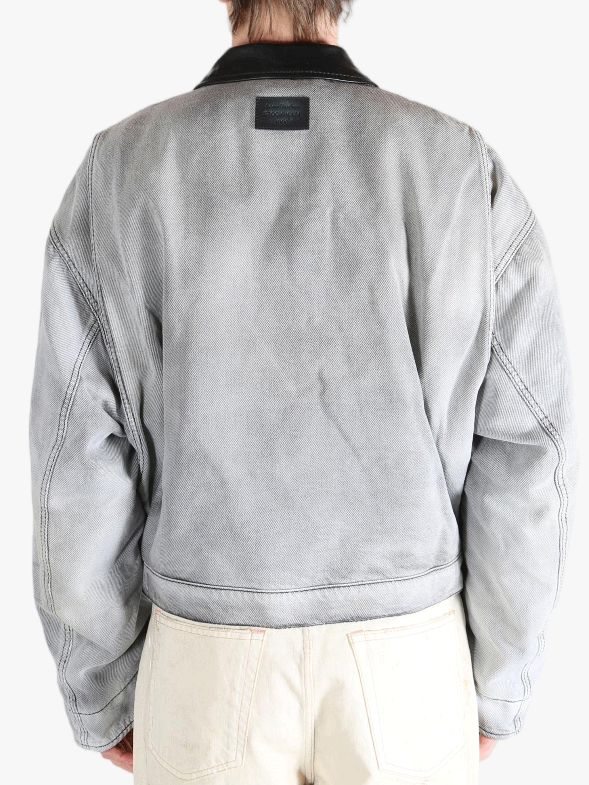 White jackets worn by a person, showing the jackets fit