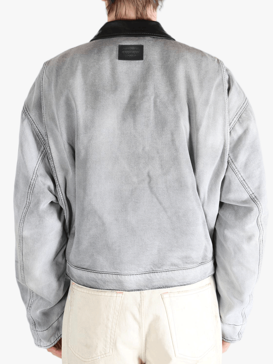 White jackets worn by a person, showing the jackets fit