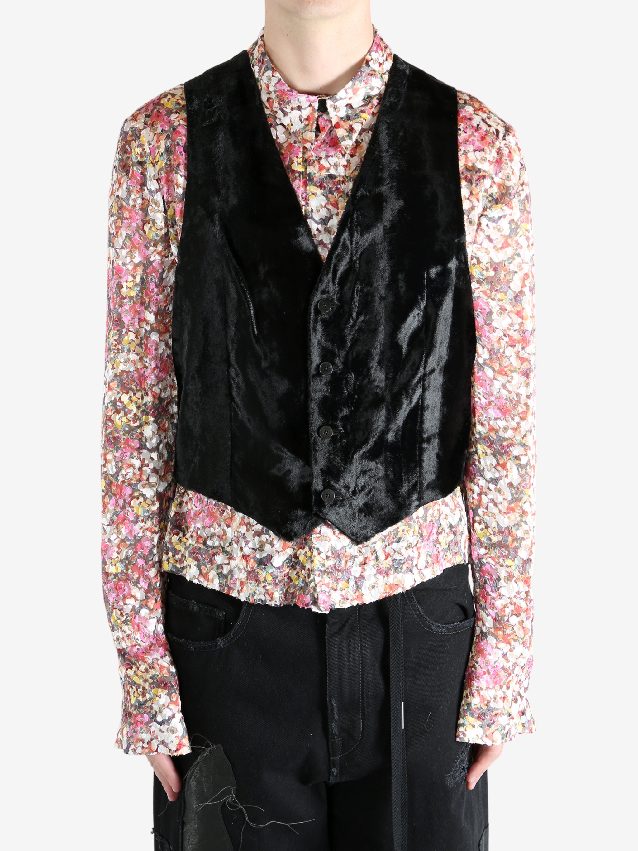 Black top worn by a person, showing the top's fit