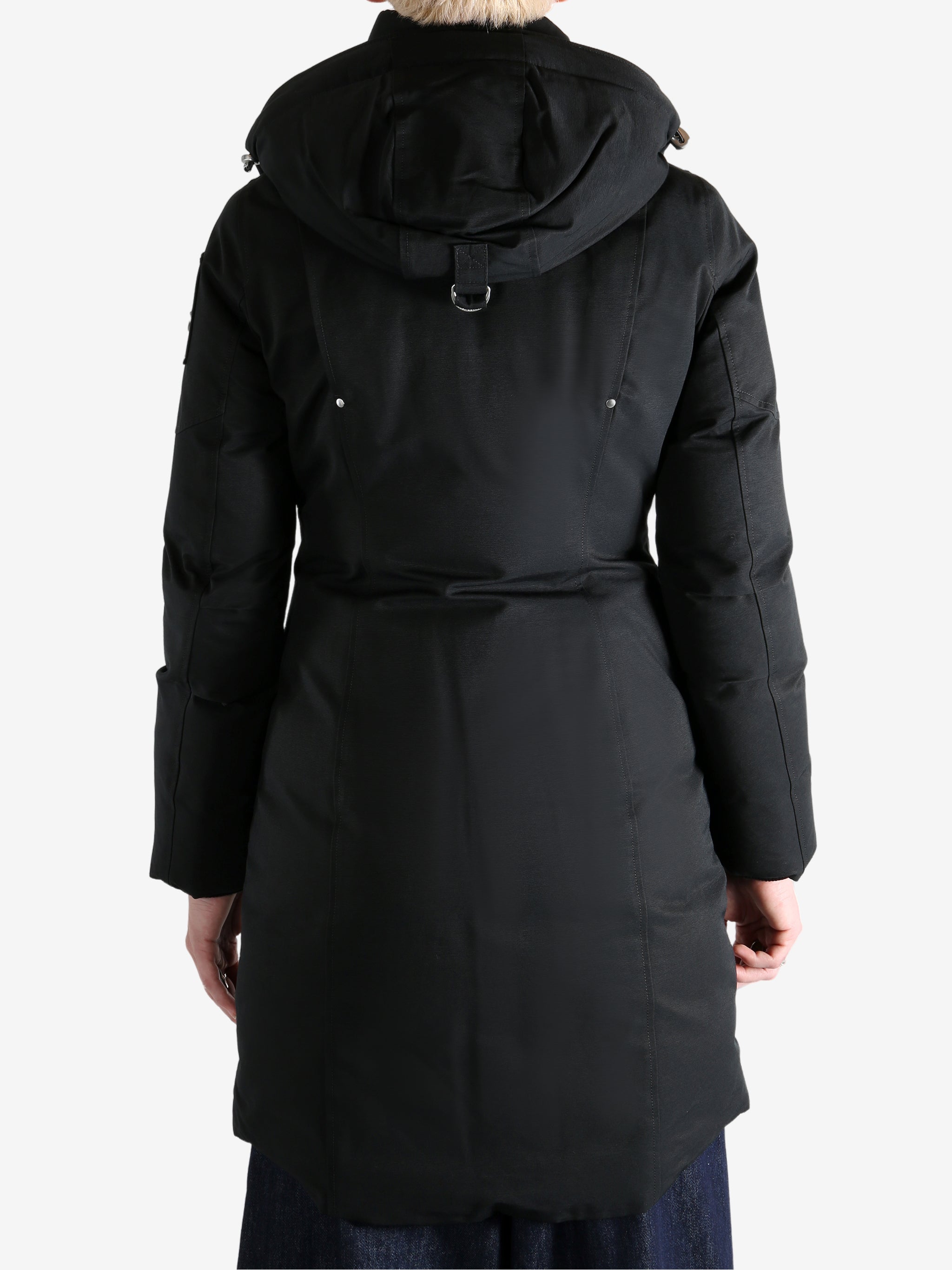 Black jacket worn by a person, showing the jacket fit