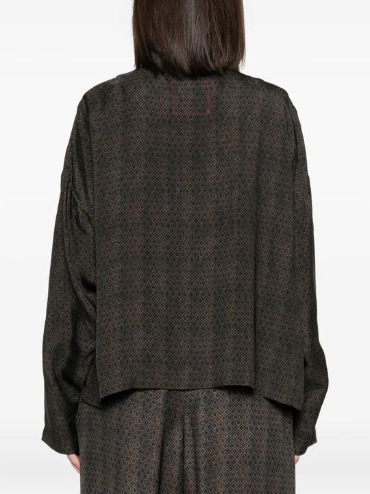 Brown jackets worn by a person, showing the jackets's fit