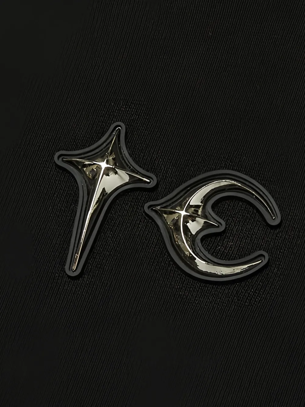 Close up of black hoodie, showing texture of the Cotton fabric