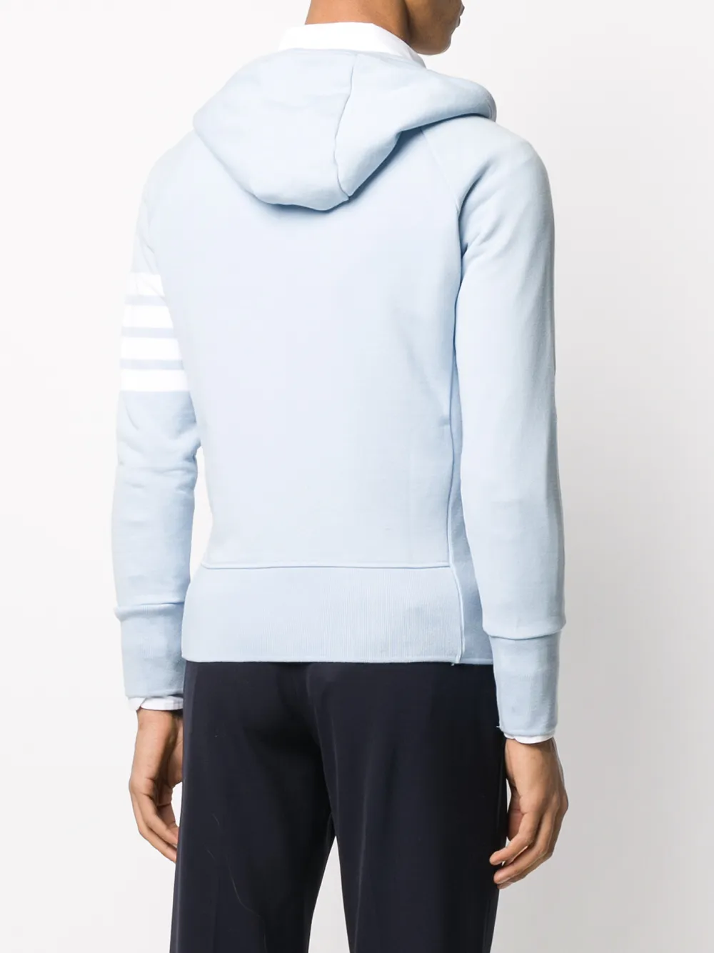 Blue coat worn by a person, showing the coat fit