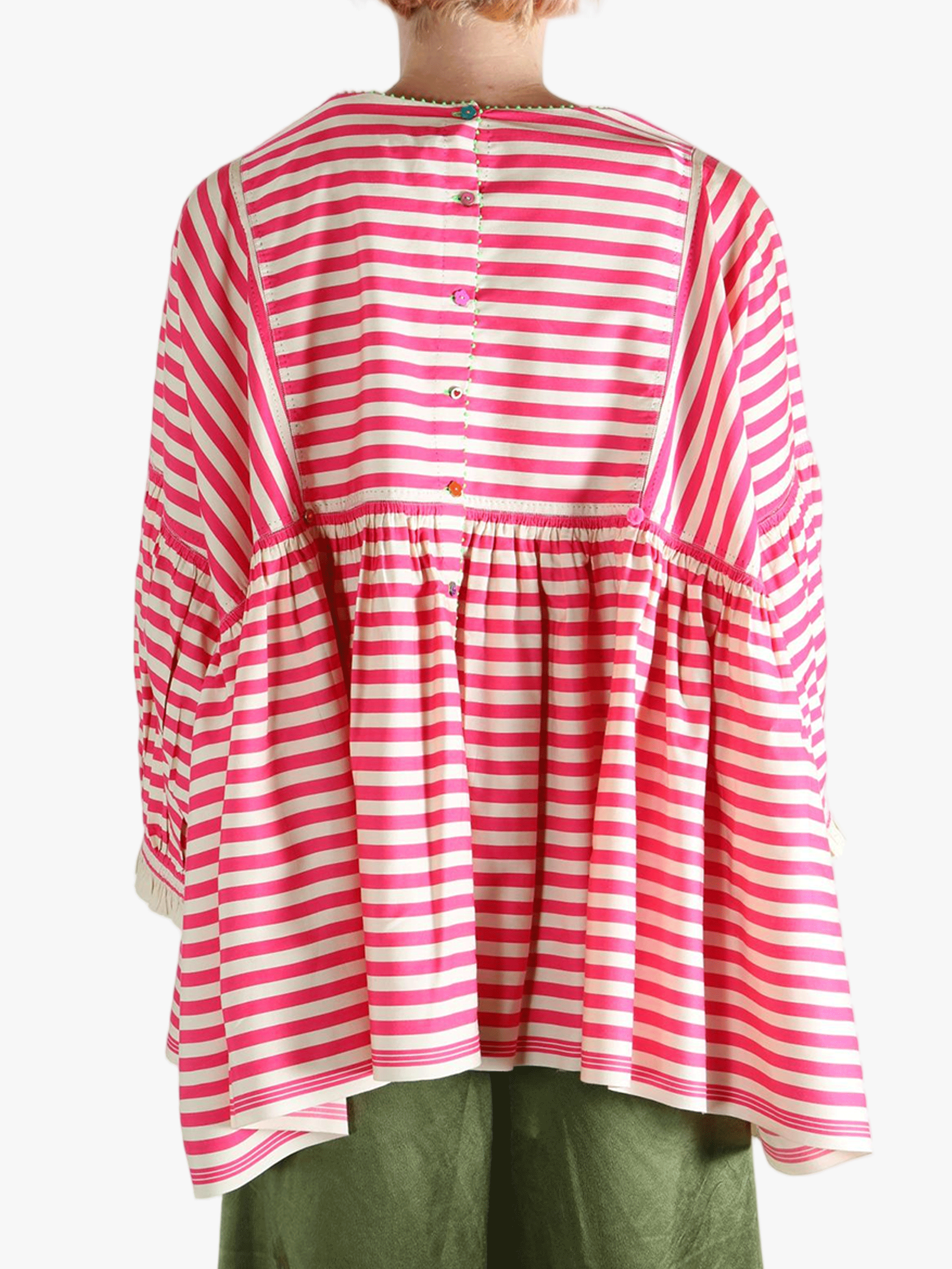 Red top worn by a person, showing the top's fit