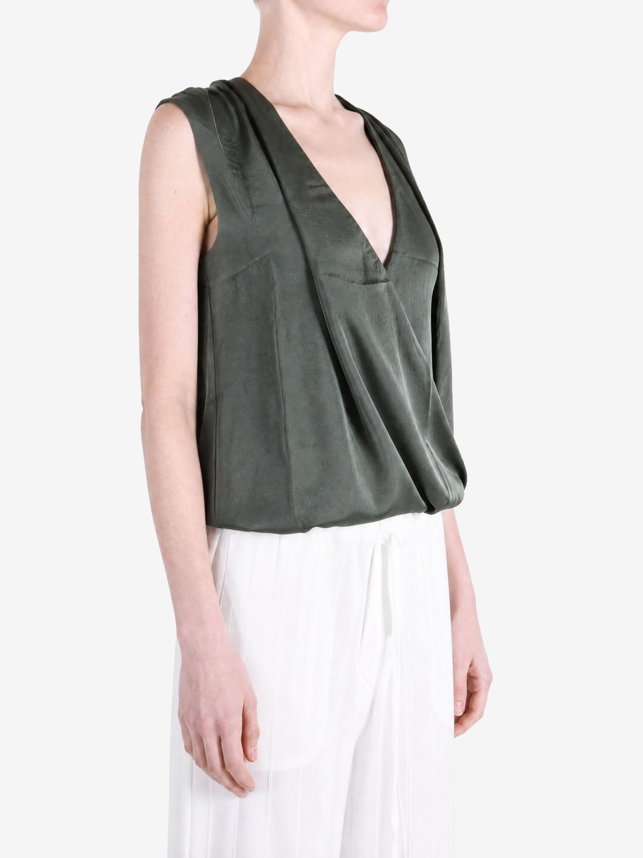 Green top worn by a person, showing the top fit