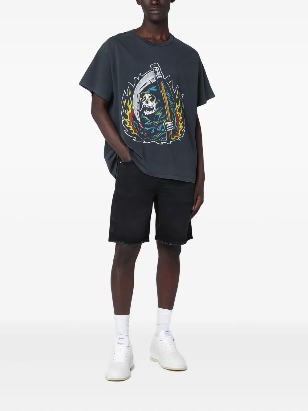 Black t-shirt worn by a person, showing the t-shirt's fit