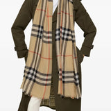 Tan scarf worn by a person, showing the scarf's fit