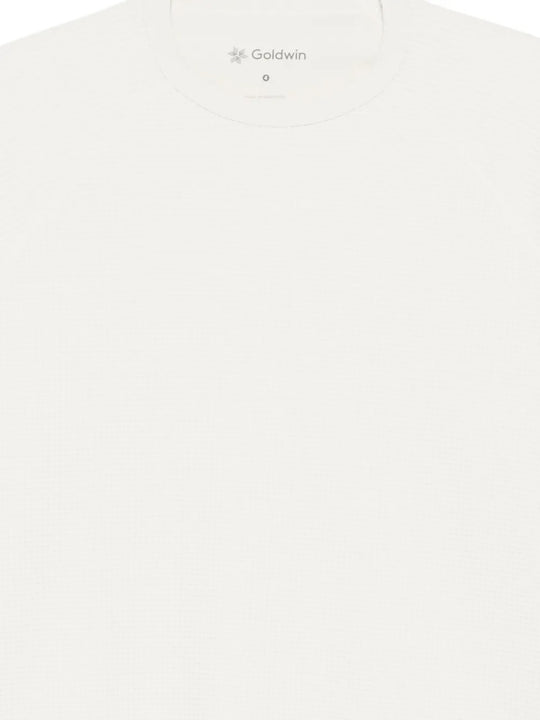 Close up of white t-shirt, showing texture of the polyester fabric