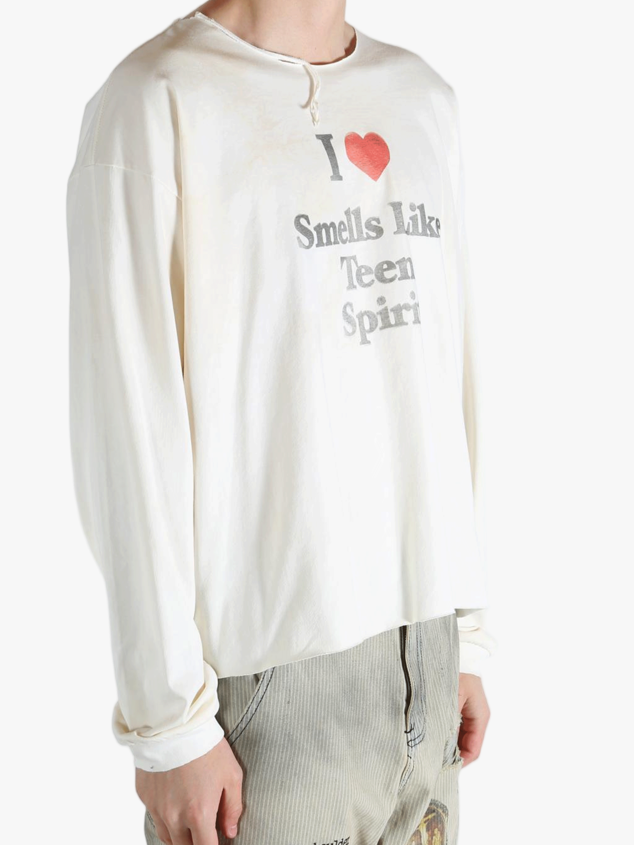 White top worn by a person, showing the top fit