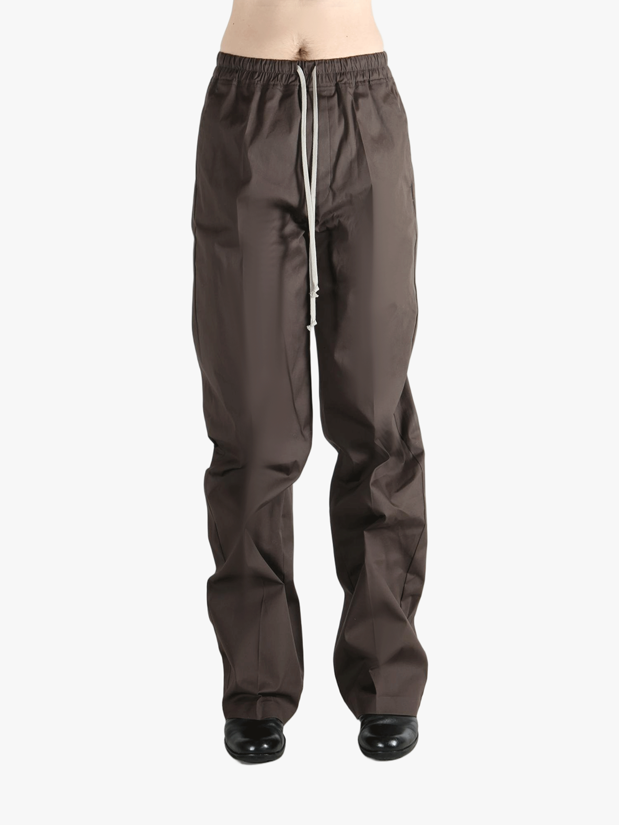 Brown pants worn by a person, showing the pants fit