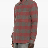 Red shirt worn by a person, showing the shirt's fit