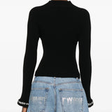 Black pullover worn by a person, showing the pullover's fit