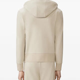 Tan hoodies worn by a person, showing the hoodies fit