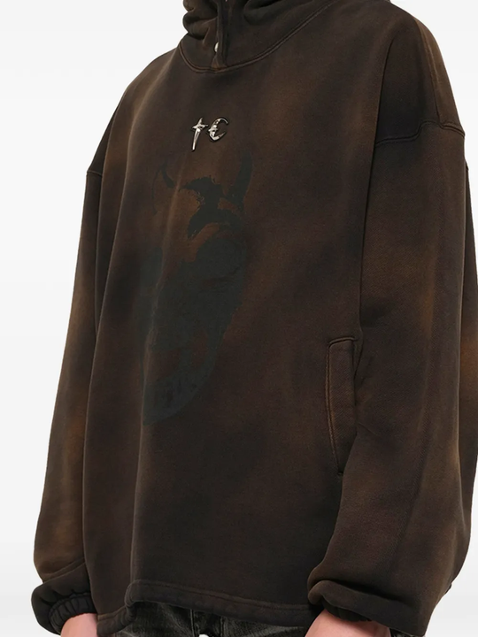 Brown hoodie worn by a person, showing the hoodie fit