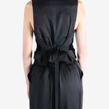 Black coat worn by a person, showing the coat's fit