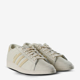 Tan sneakers, side view