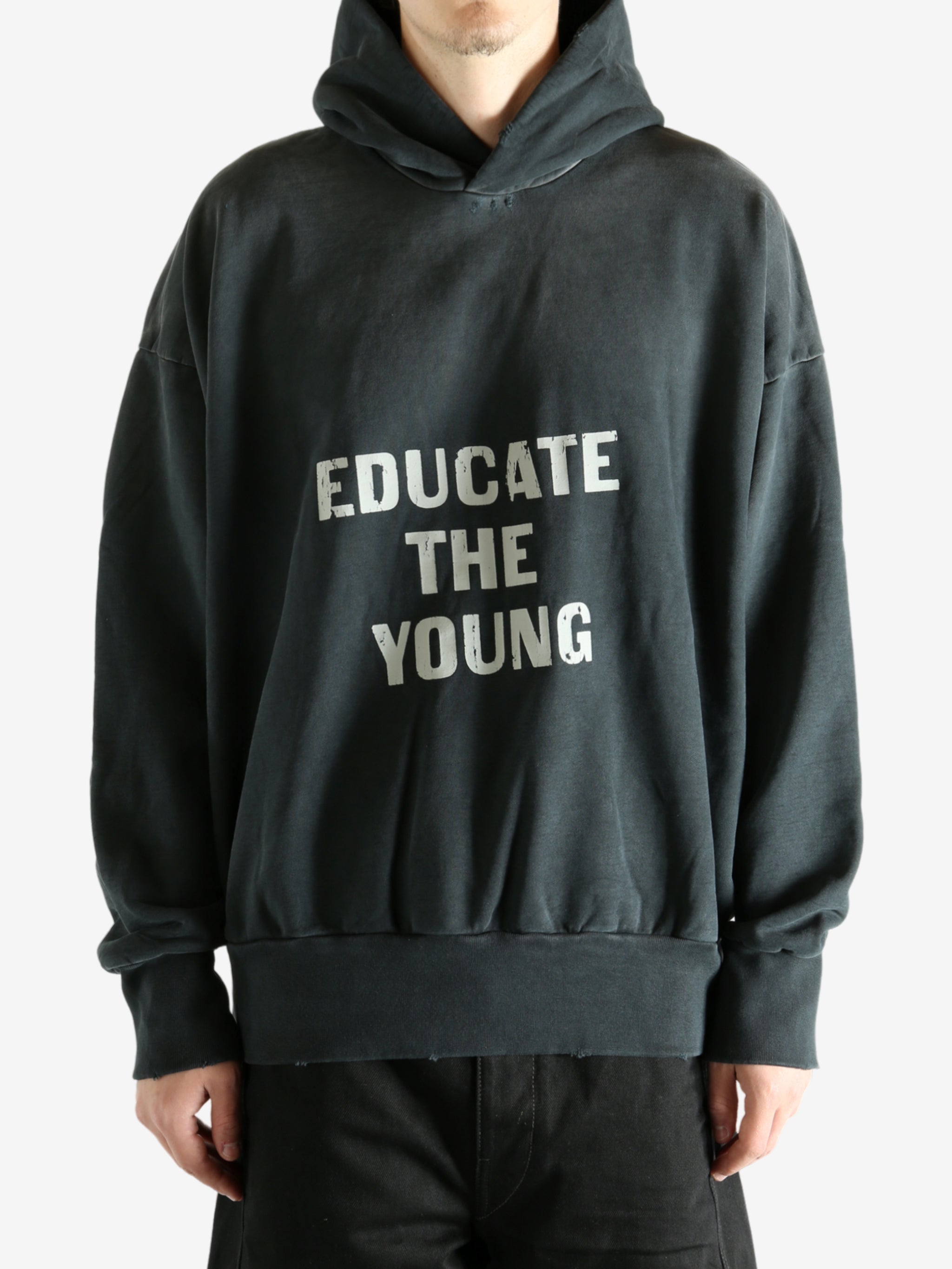 Black hoodie worn by a person, showing the hoodie's fit