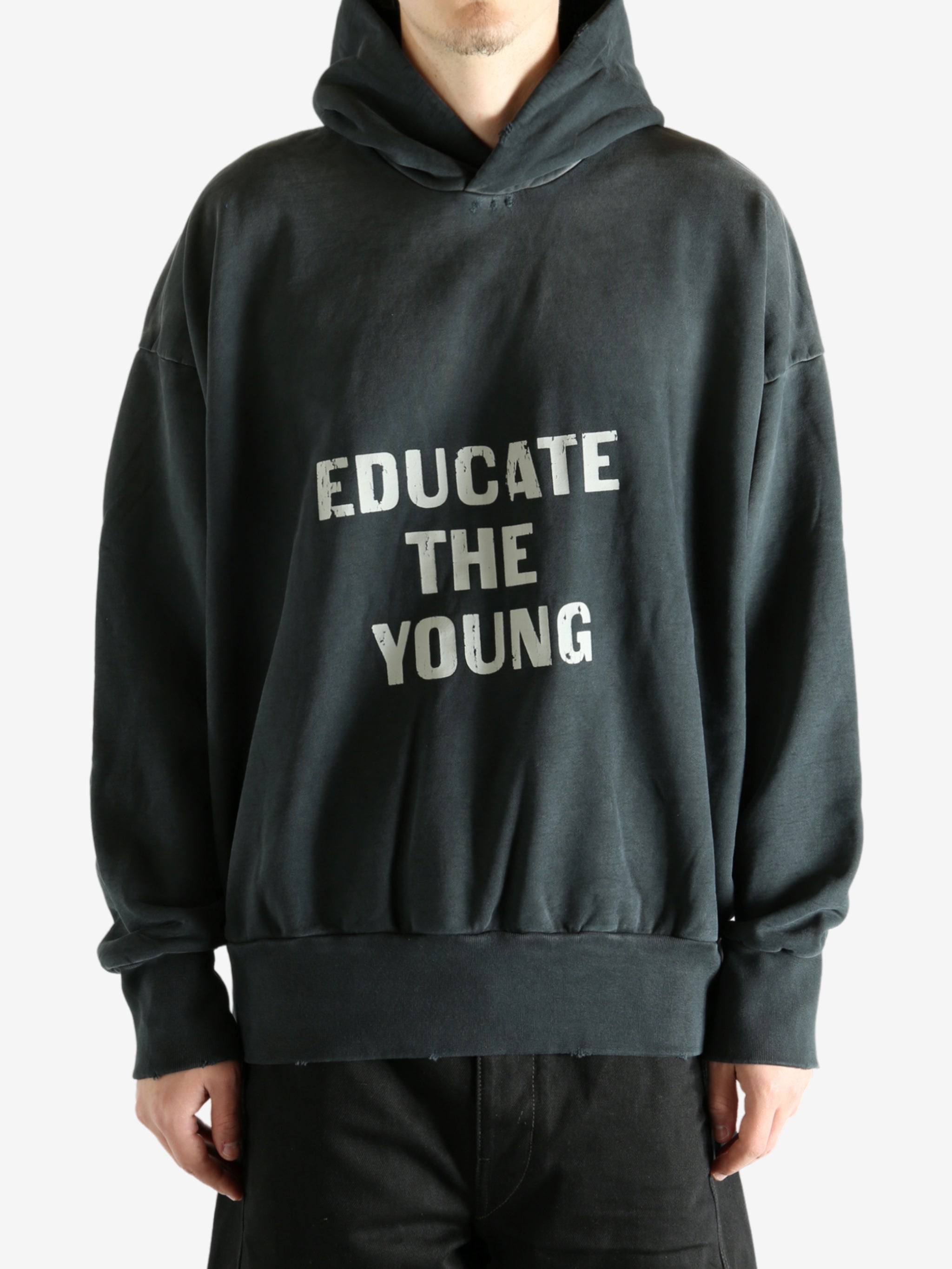 Black hoodie worn by a person, showing the hoodie's fit