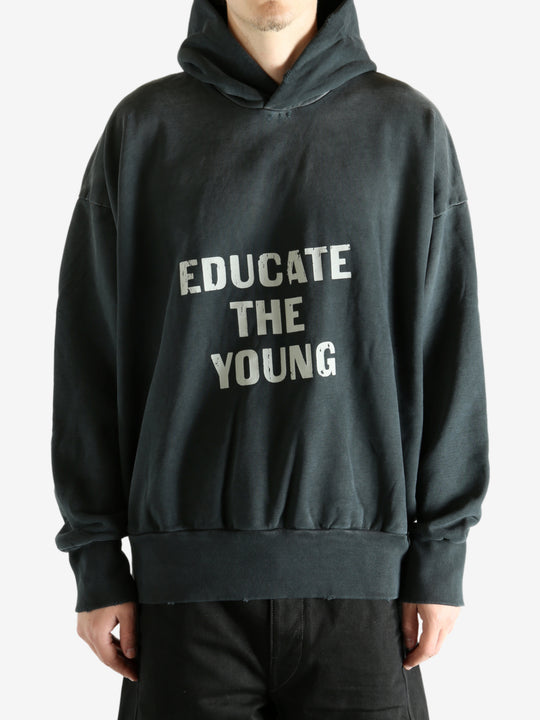 Black hoodie worn by a person, showing the hoodie's fit