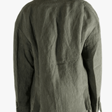 Green jackets worn by a person, showing the jackets fit