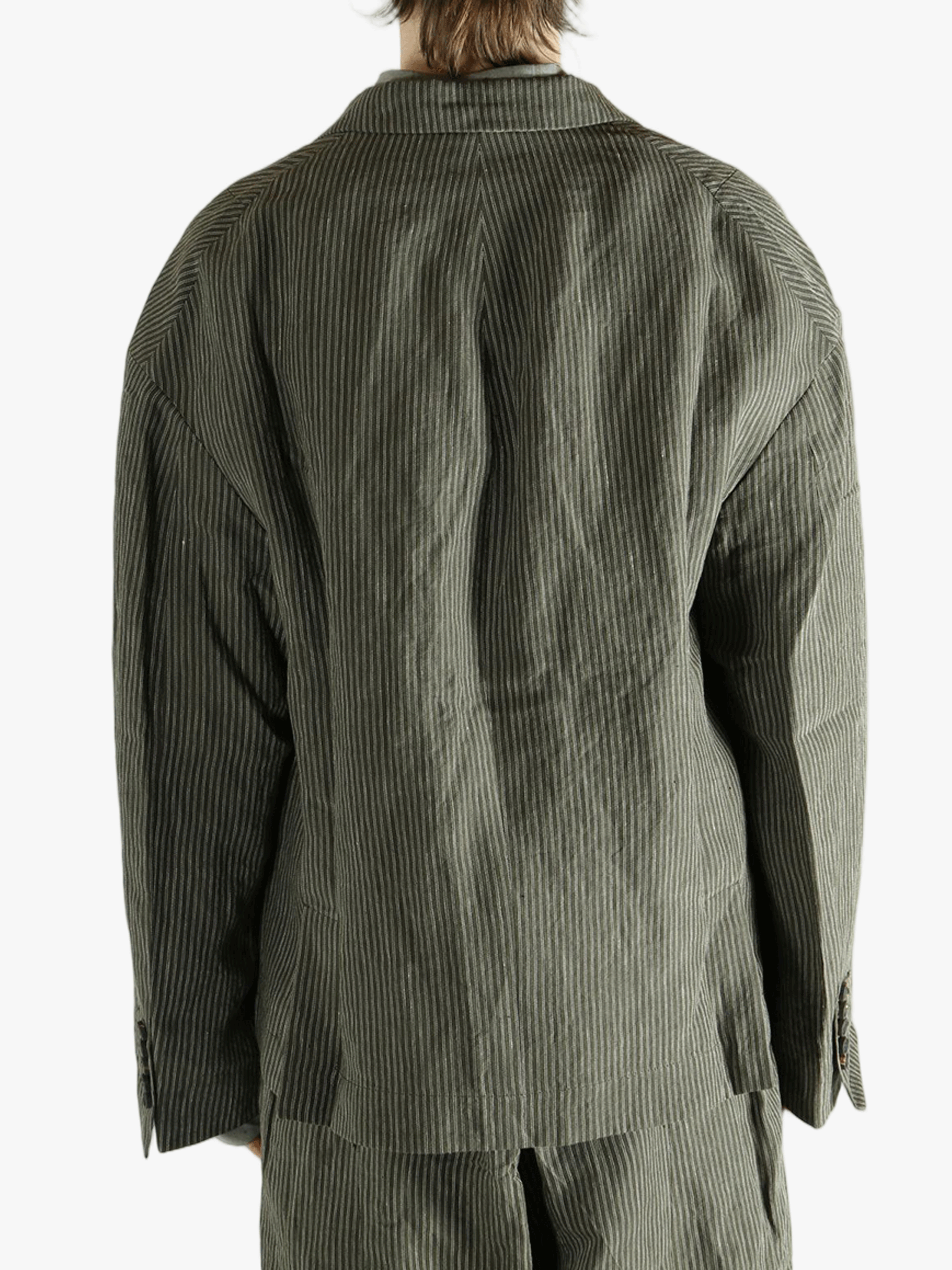 Green jackets worn by a person, showing the jackets fit