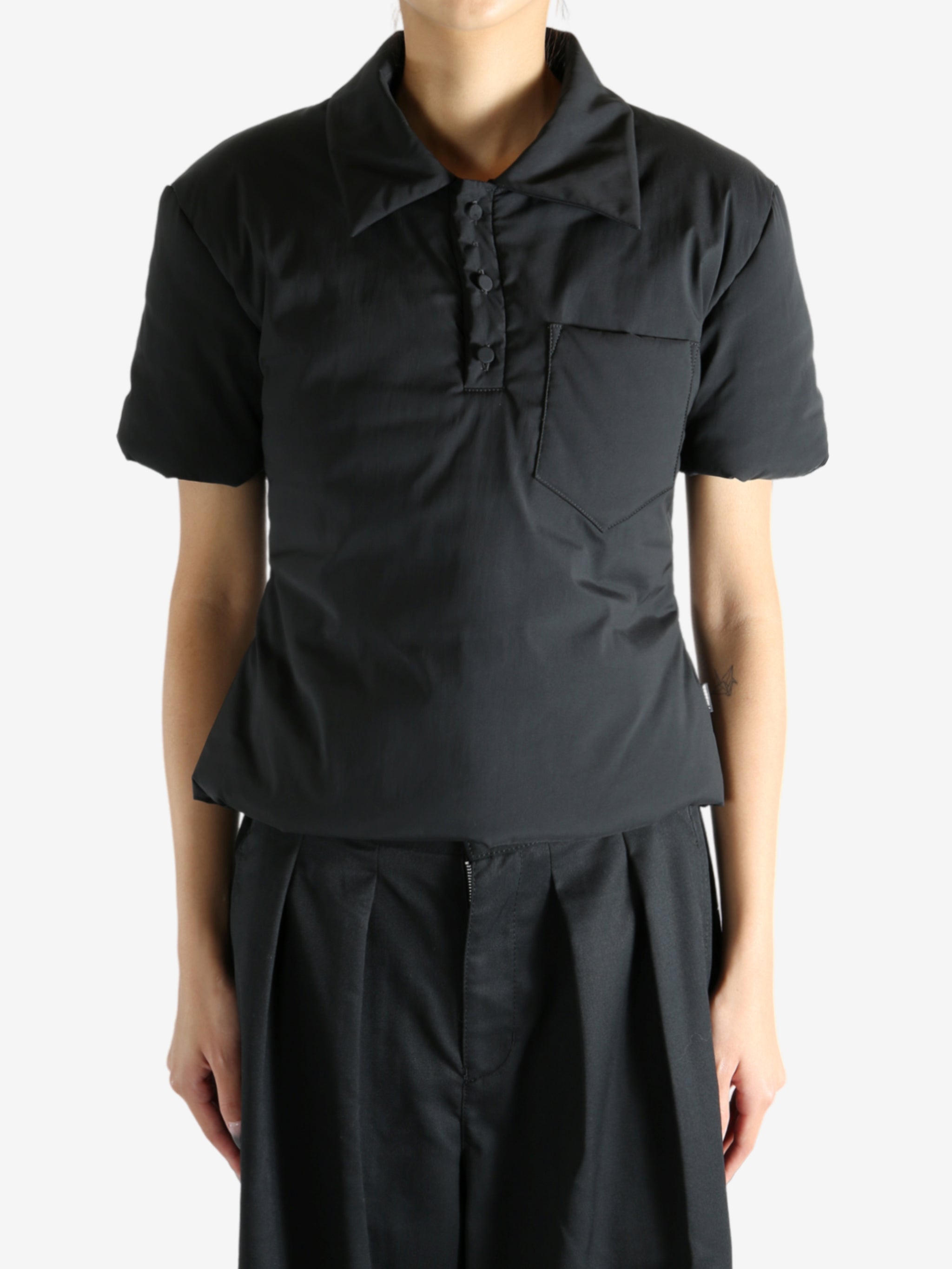 Black t-shirt worn by a person, showing the t-shirt's fit