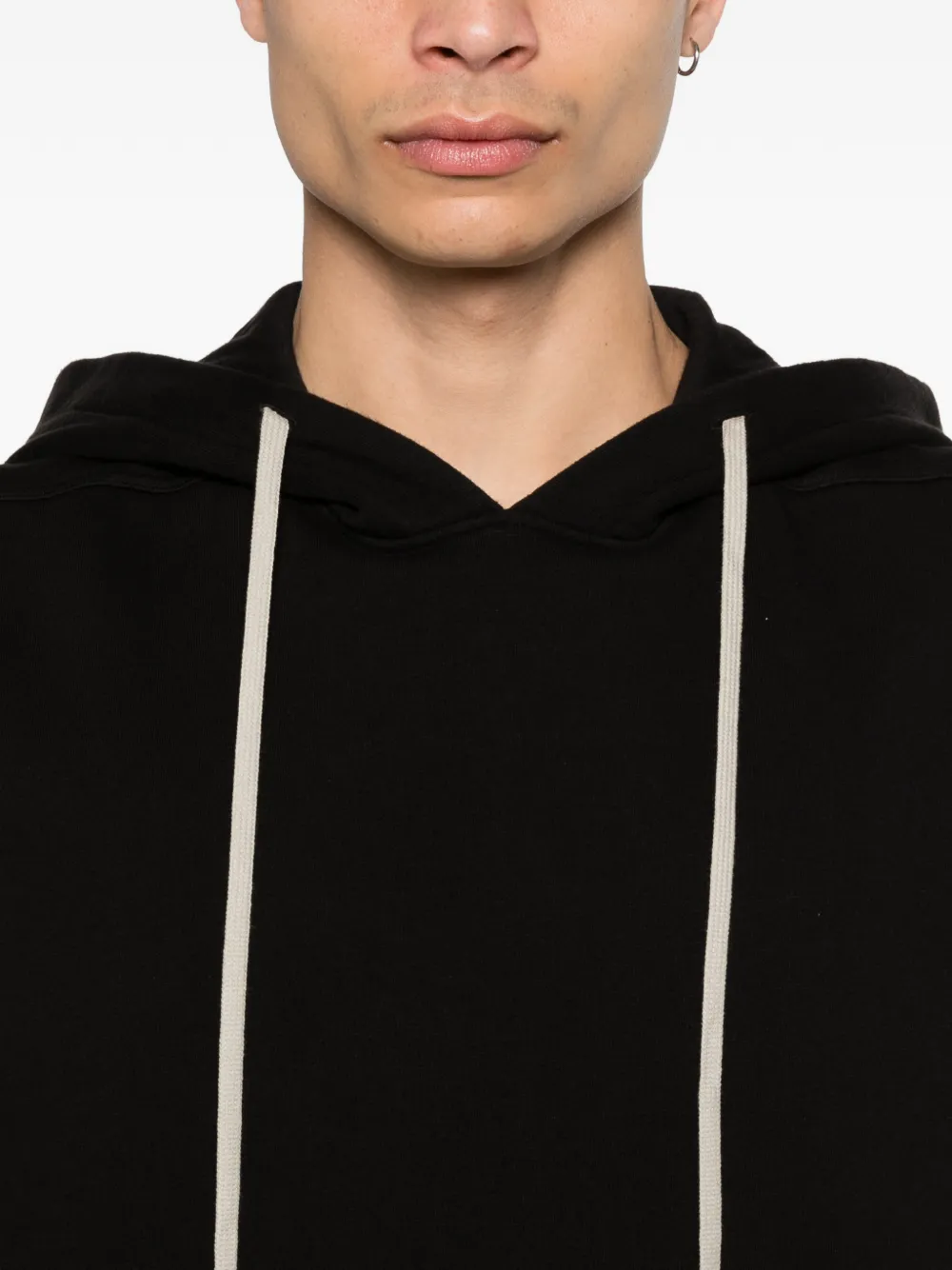 Close up of black sleeveless hoodie,showing texture of the cotton fabric