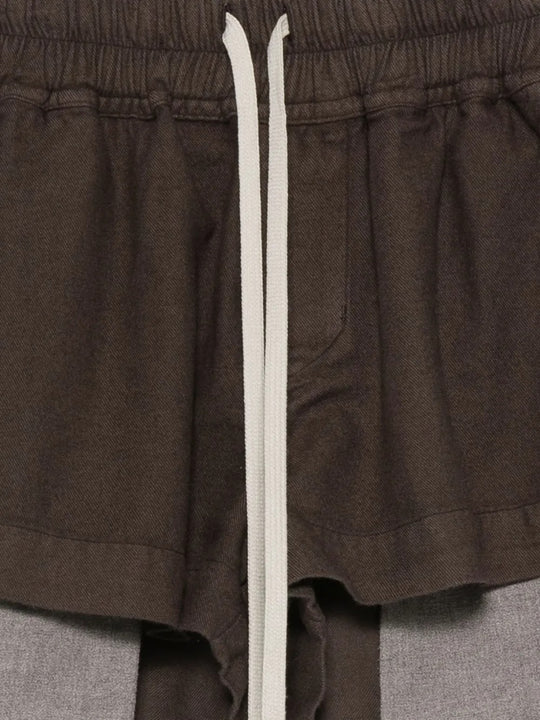 Close up of the brown shorts, showing texture of the cotton fabric