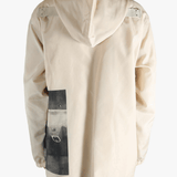 Tan jacket worn by a person, showing the jacket's fit