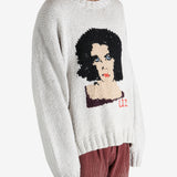 Grey sweater worn by a person, showing the sweater fit