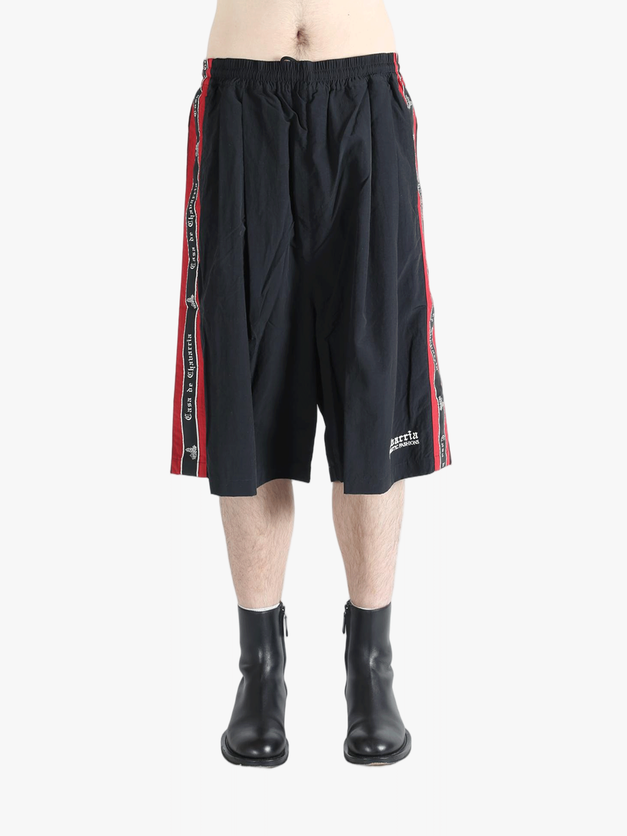 Black short worn by a person, showing the short's fit