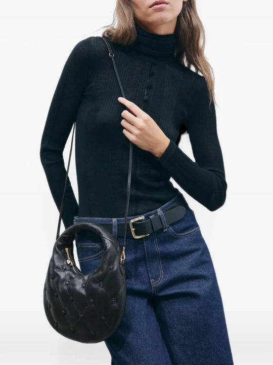 Black bag worn by a person, showing the bag fit