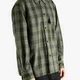 Black shirt worn by a person, showing the shirt's fit