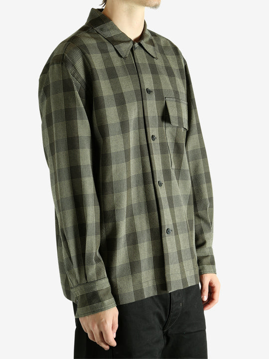 Black shirt worn by a person, showing the shirt's fit