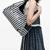 blue bags worn by a person, showing the bags fit