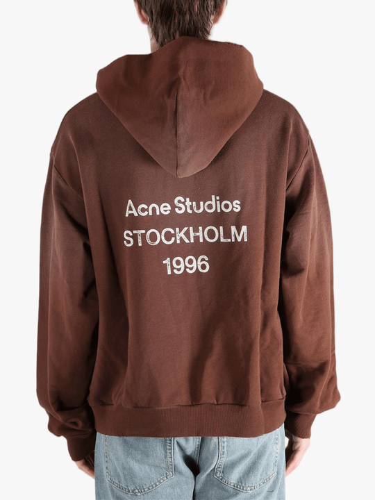 Brown sweats-hoodies worn by a person, showing the cotton fit
