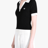 Black shirt worn by a person, showing the shirt fit