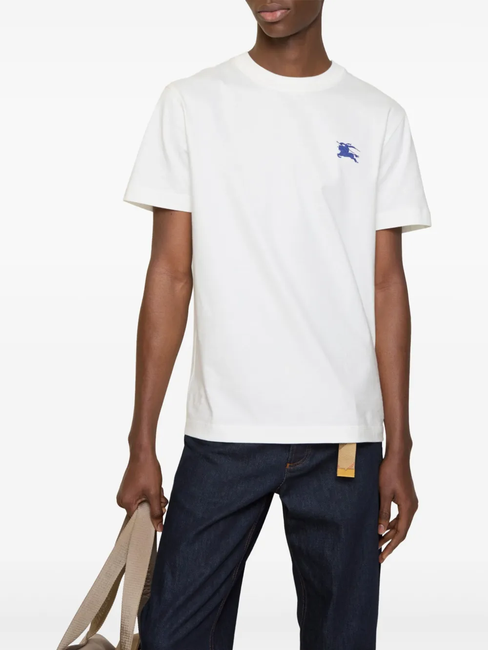 White t-shirts worn by a person, showing the t-shirts fit