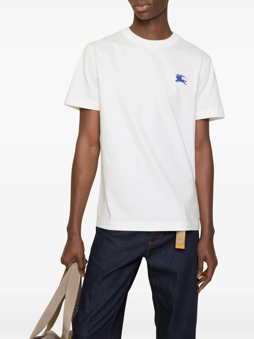 White t-shirts worn by a person, showing the t-shirts fit