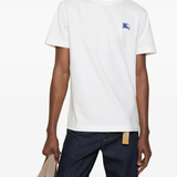 White t-shirts worn by a person, showing the t-shirts fit