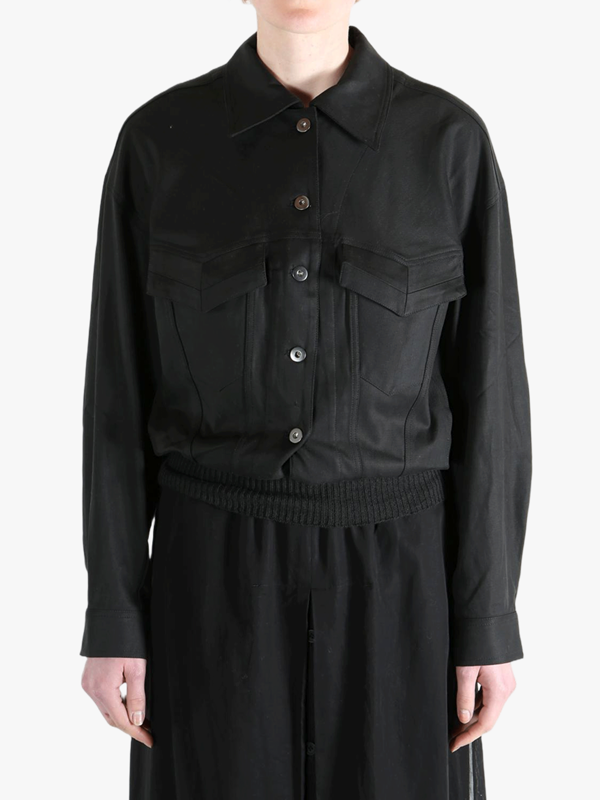 black jackets-coats worn by a person, showing the jackets-coats fit