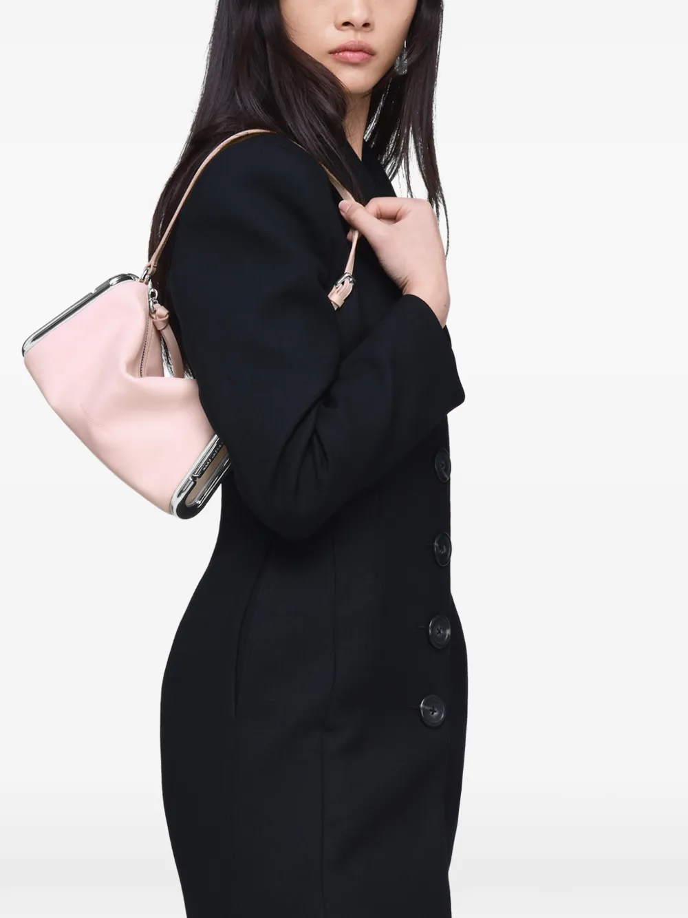 Pink bag worn by a person, showing the bag fit