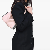 Pink bag worn by a person, showing the bag fit