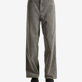 Brown pants worn by a person, showing the pants' fit