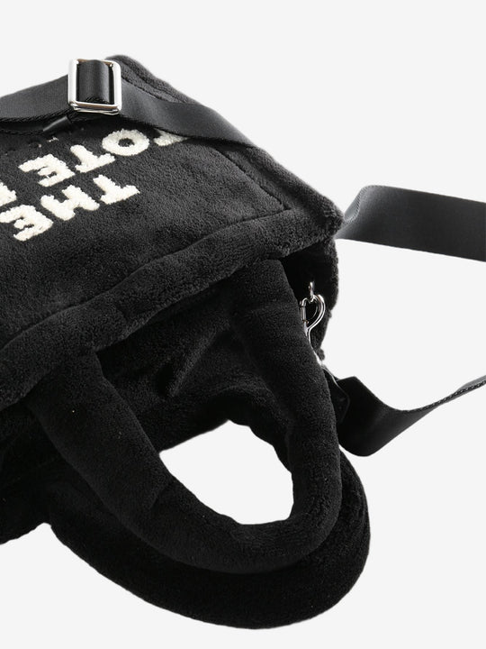 Close up of the black bag, showing texture of the polyester fabric