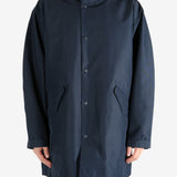 Navy jackets worn by a person, showing the jacket’s fit