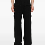 Black pants worn by a person, showing the pants fit